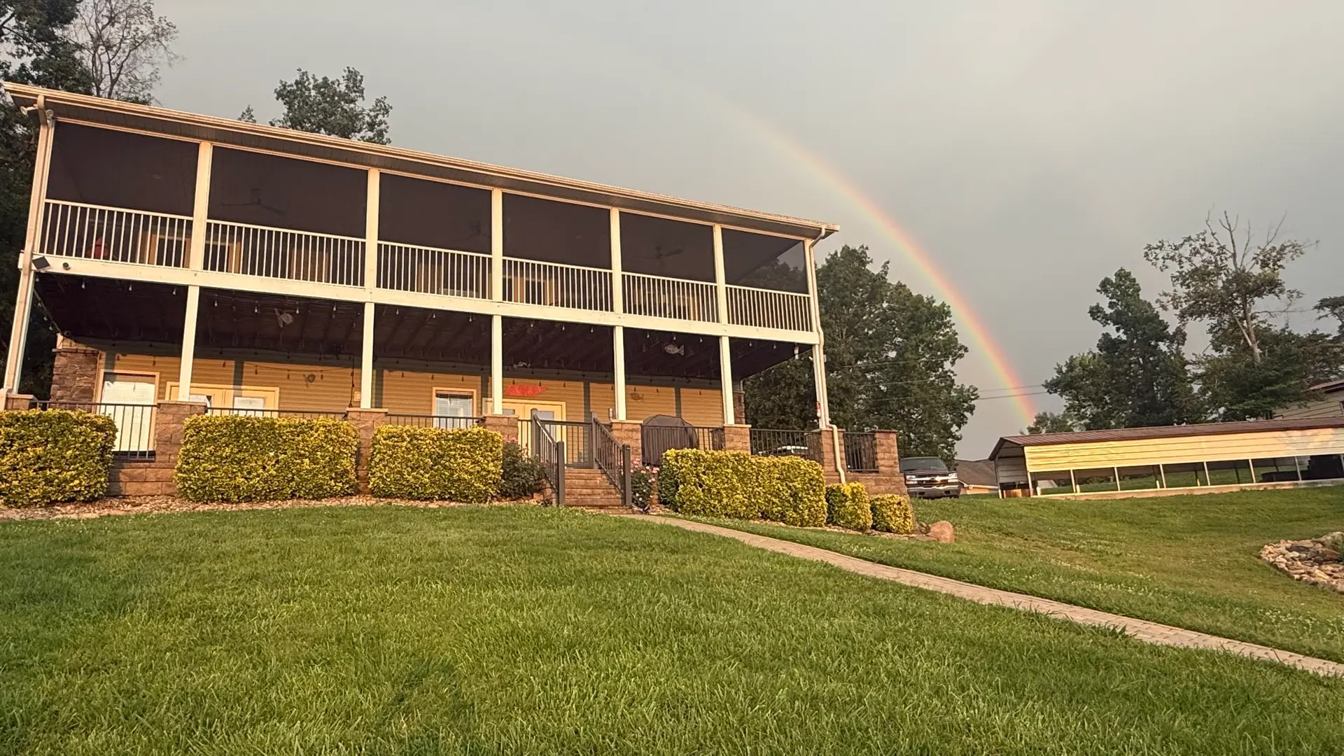 Rainbow arching over the two 48-foot porches of Fort Sunsets
