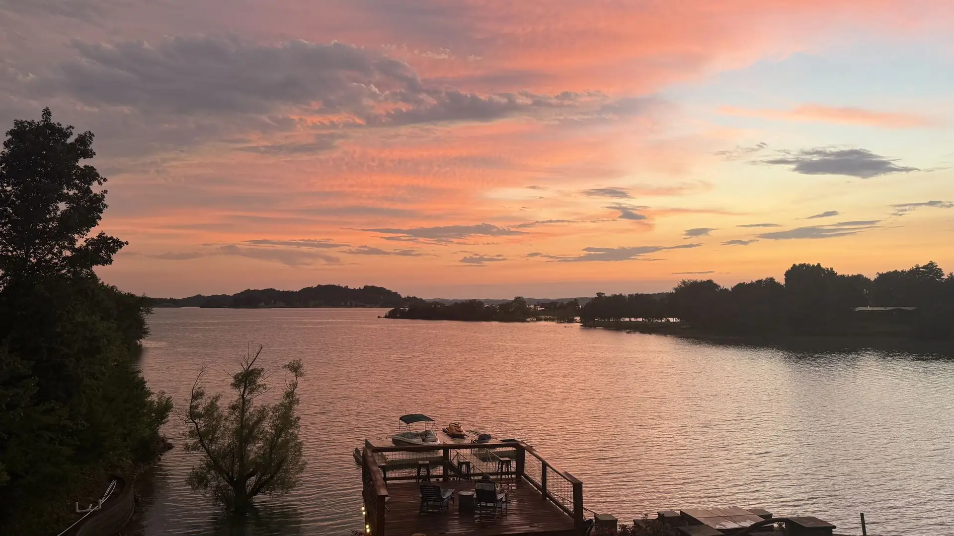 Dramatic sunset clouds over the sundeck and dock