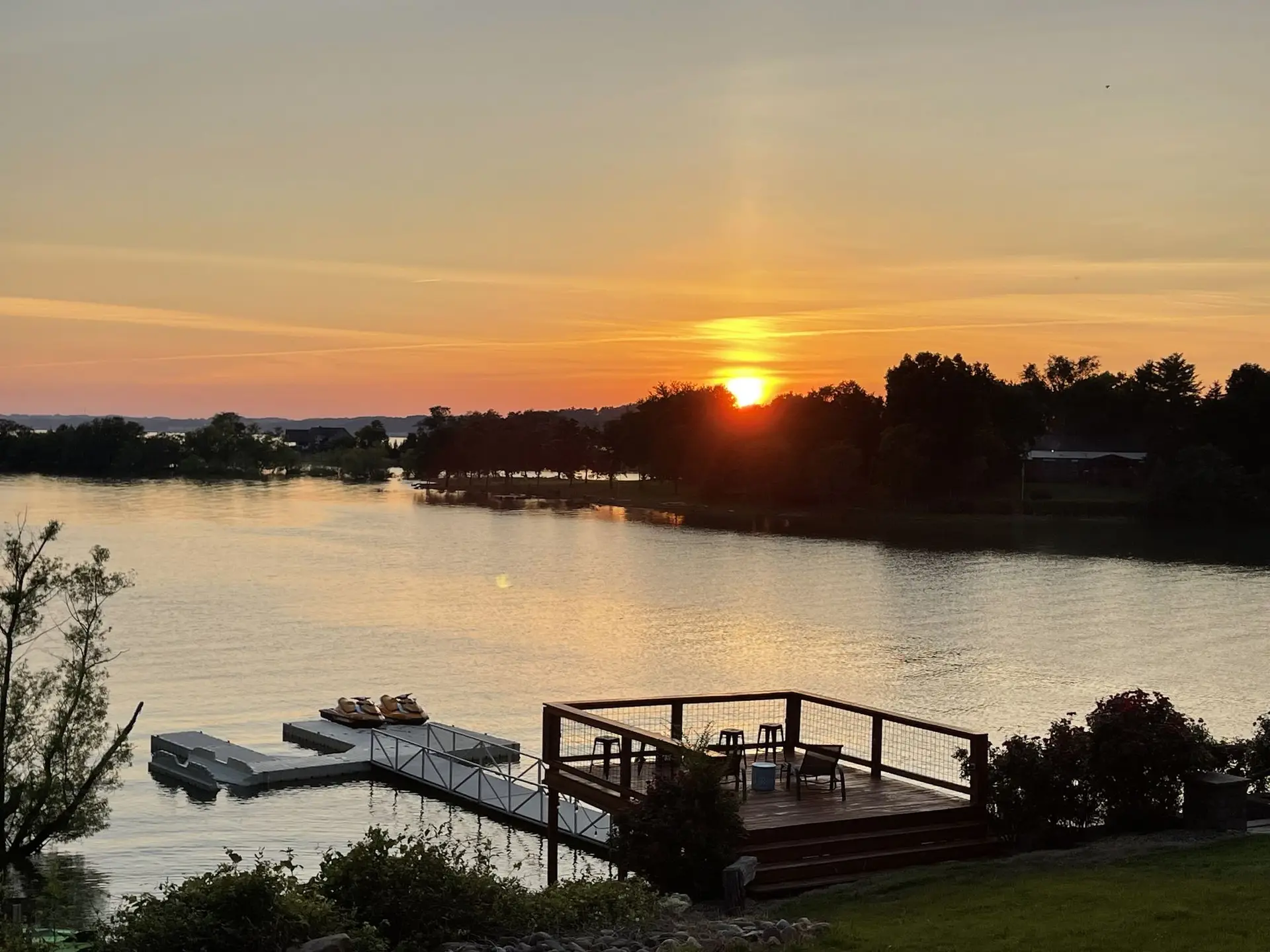 Sunset over the sundeck, dock and lawn
